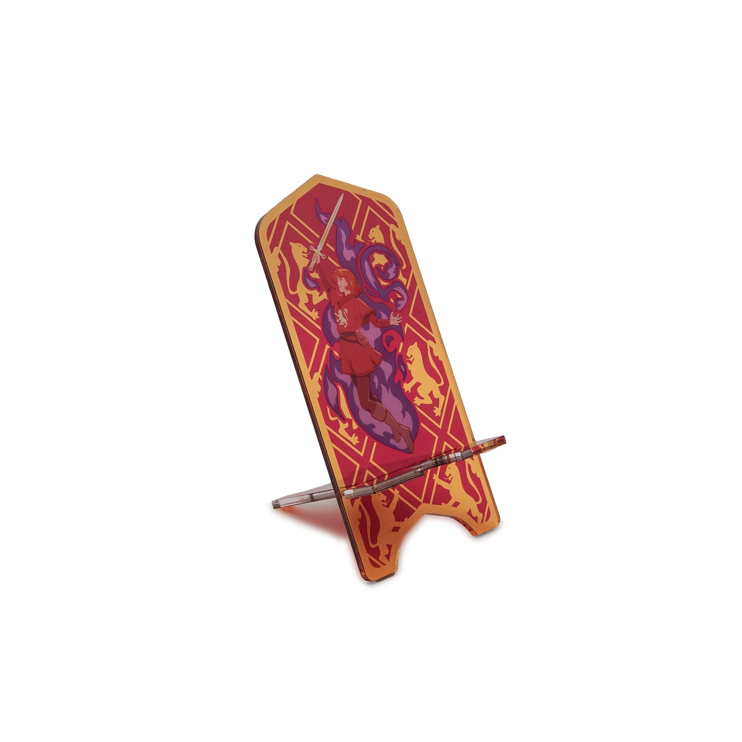 A product photo of the Alanna Acrylic Phone Standee. The background of the standee is a red and gold large diamond pattern, with rampant gold lions in the outer diamonds. In the center is Alanna, wearing a red tunic with a gold lion on the chest, floating upward amidst her purple magic fire and holding Lightning, her sword, aloft.
