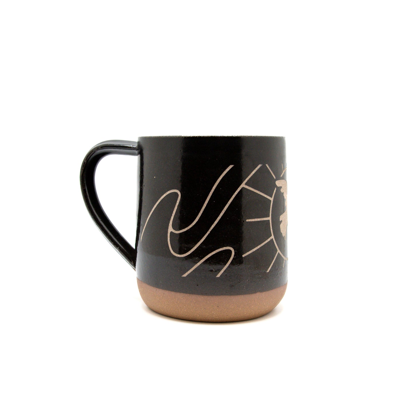 A product photo of the side of the dancing dove sandcarved mug, showing more of the swirled details.