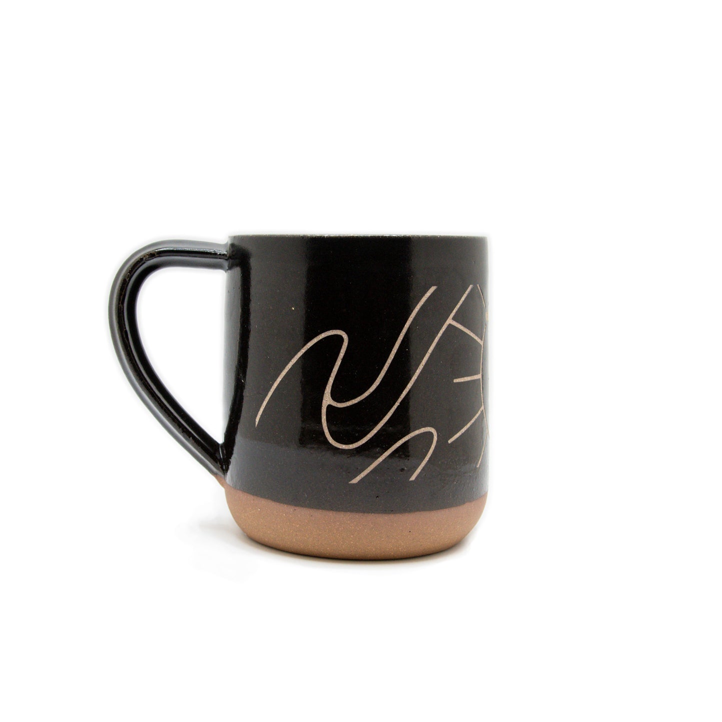 A product photo of the side of the dancing dove sandcarved mug, showing more of the swirled details.