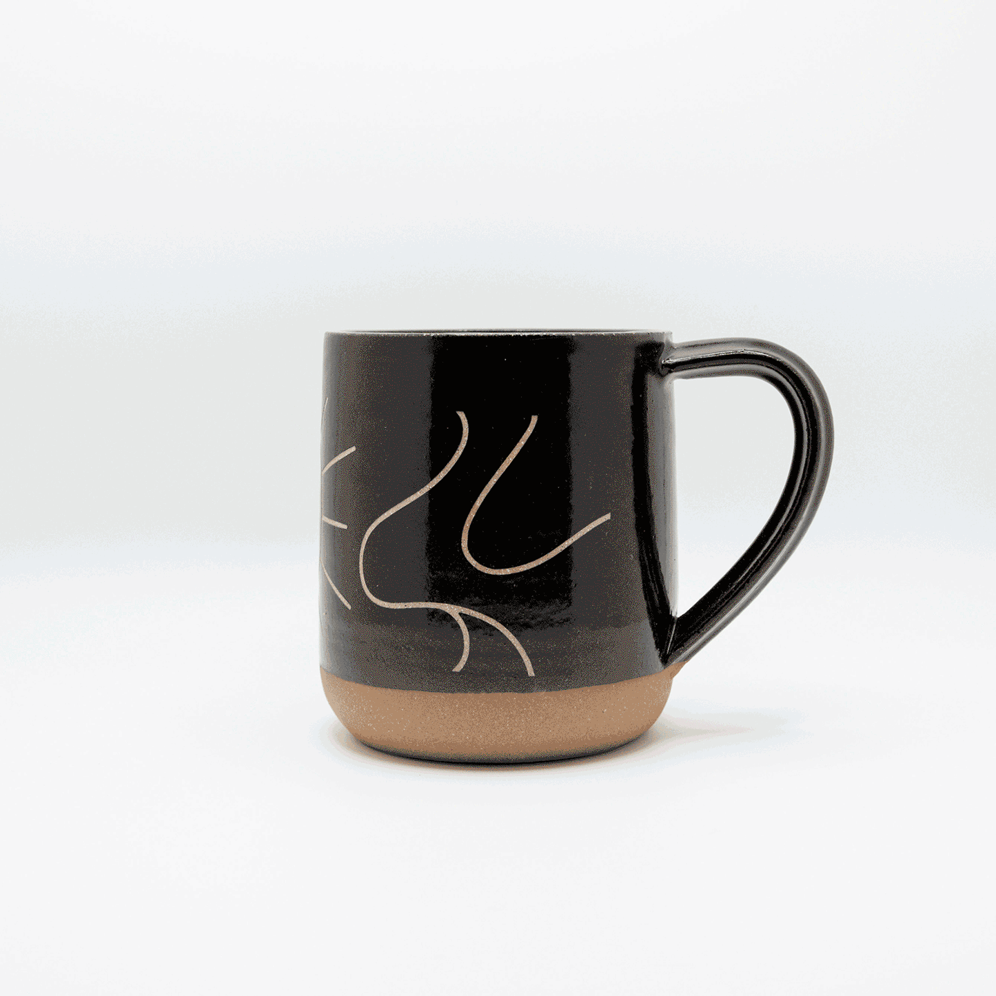 An animated gif of the dancing dove sandcarved mug spinning slowly from side to side.