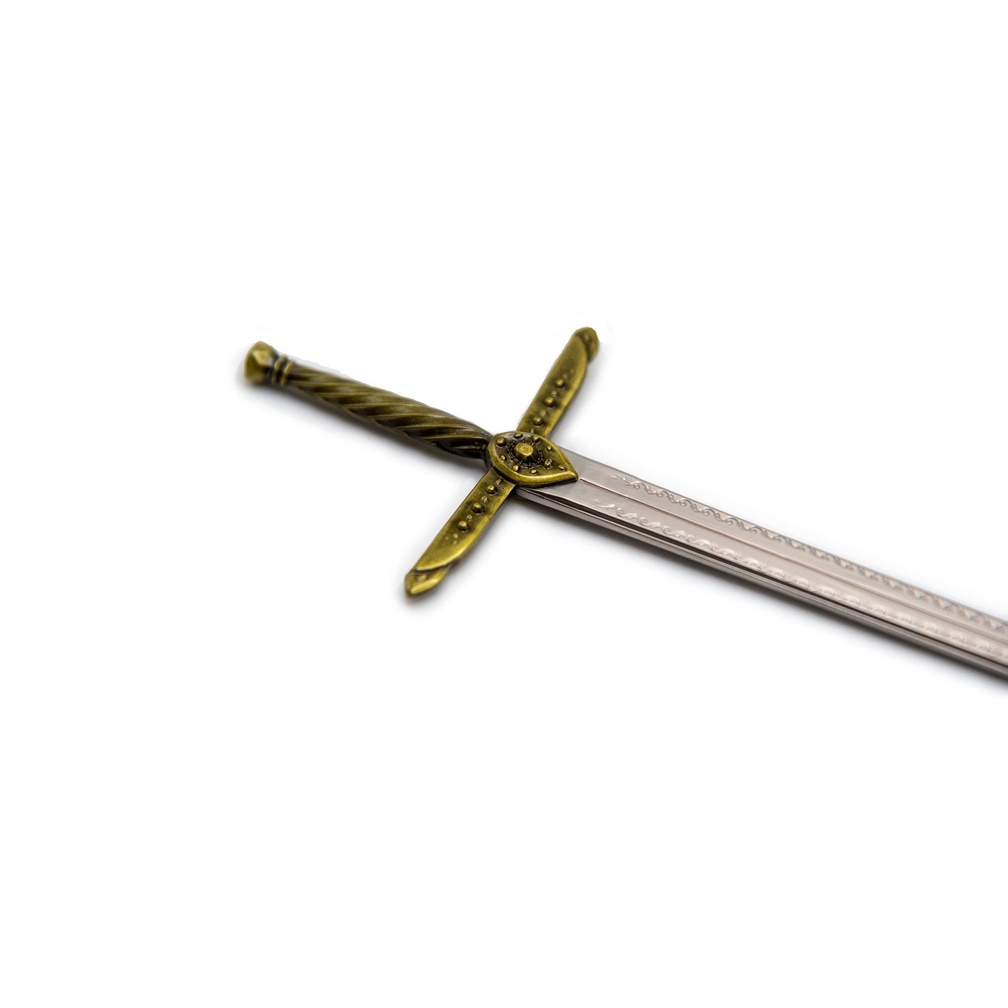 A closeup of the golden hilt of the Tamora Pierce Lightning Mini Sword. The hilt is twisted metal and the crossguard has tactile circular details.