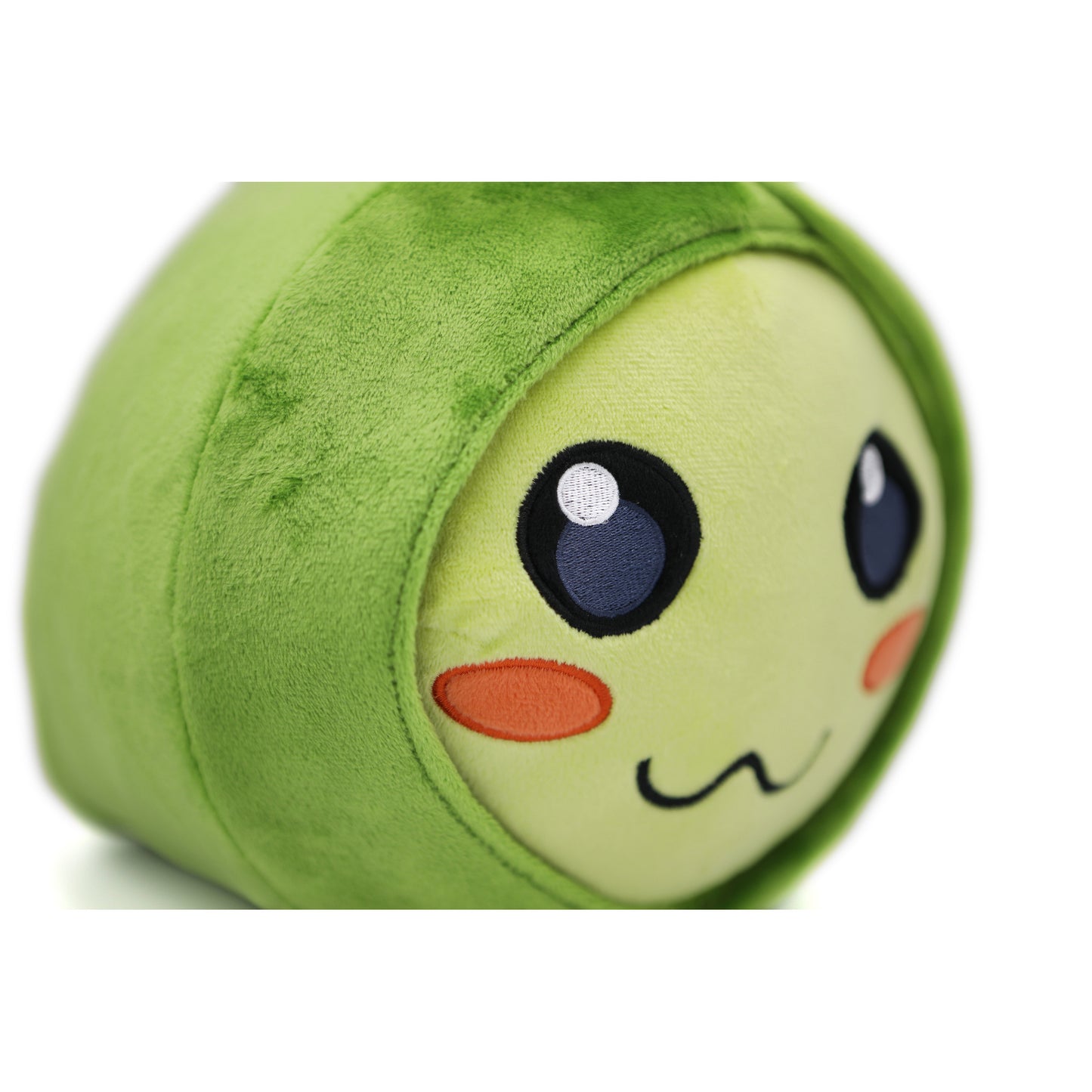 Closeup of shining eye, coral blush, and squiggle mouth embroidery on the Pilfer plush's face.