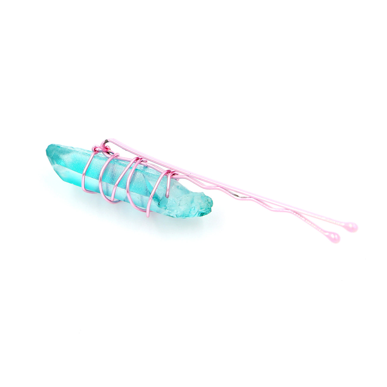 Light blue crystal on pink pin on white background.