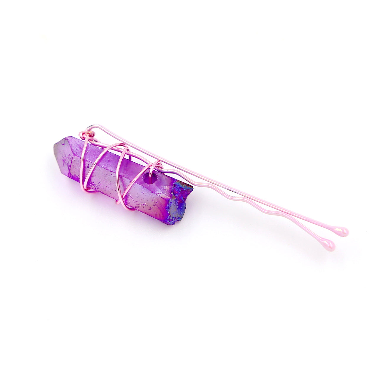 Purple crystal on pink pin on white background.
