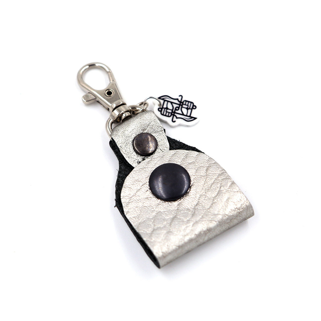 Silver leather headphone keepers with Dual Wield Studio logo and silver clasp on white background.