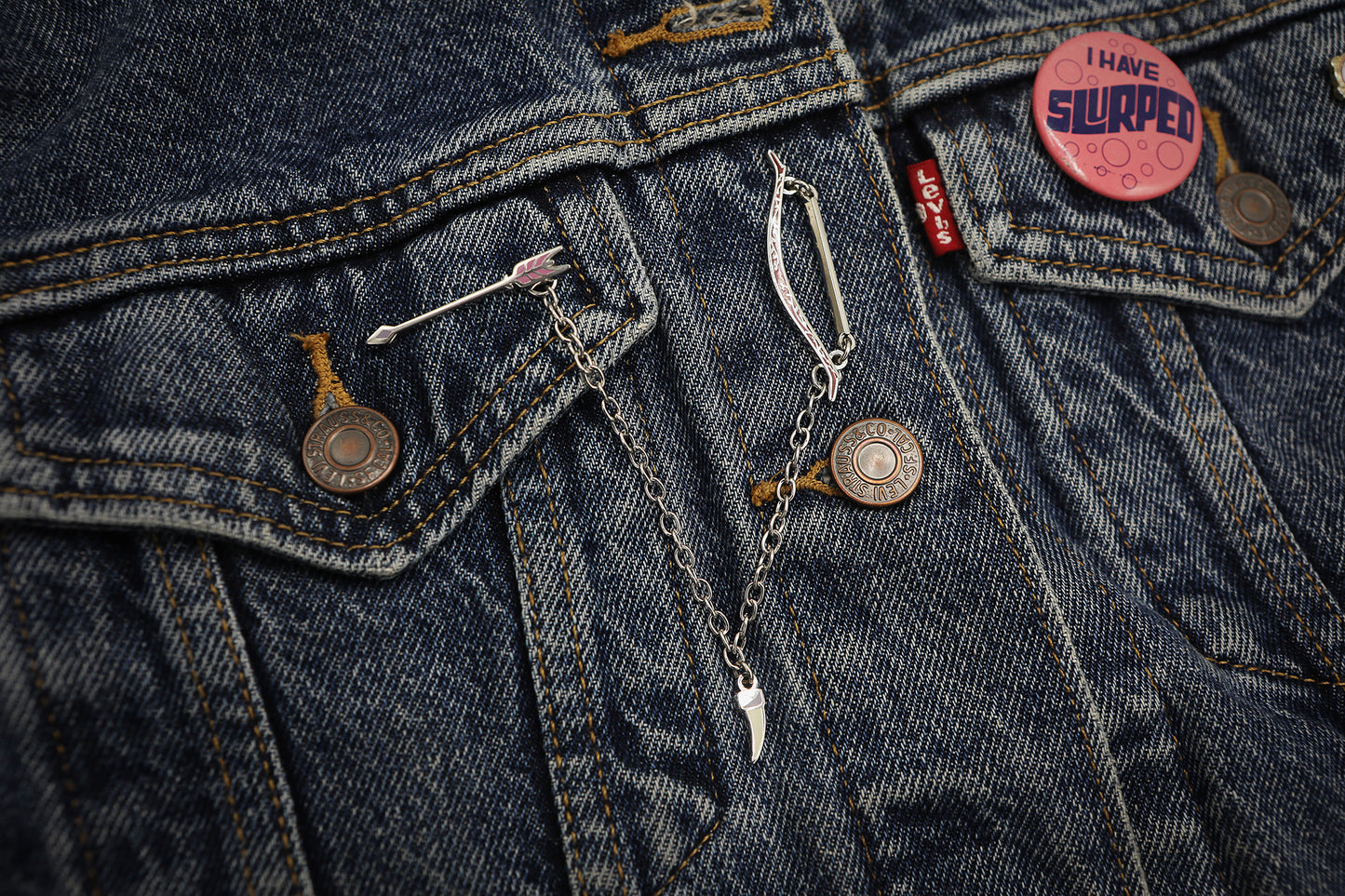 Daine Linked Collar Lapel Pin on denim jacket.