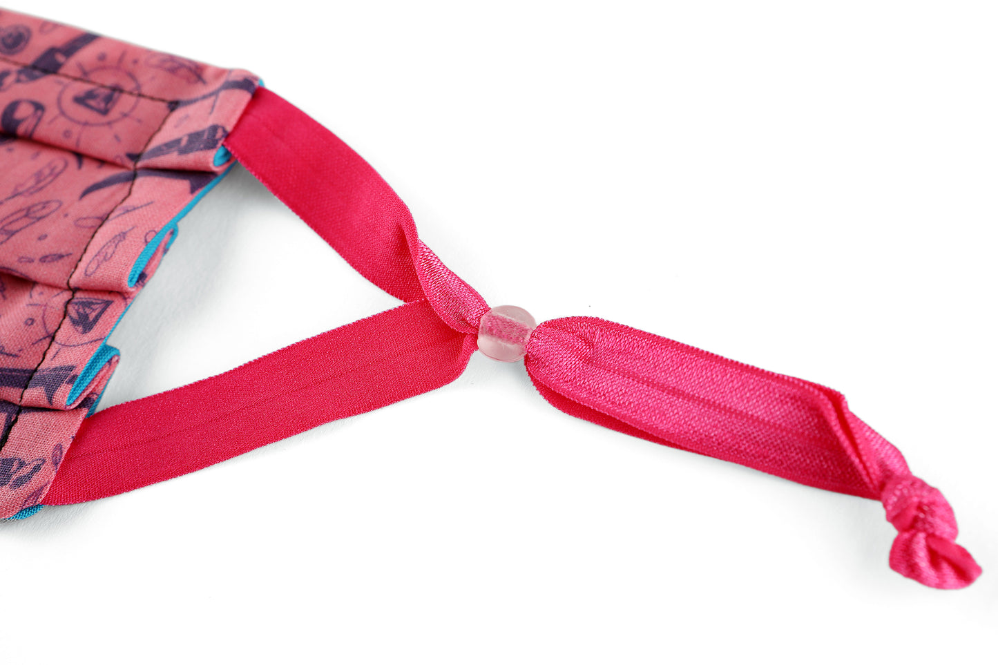 Detail of hot pink adjustable ear loops on Weapons & Spells mask.