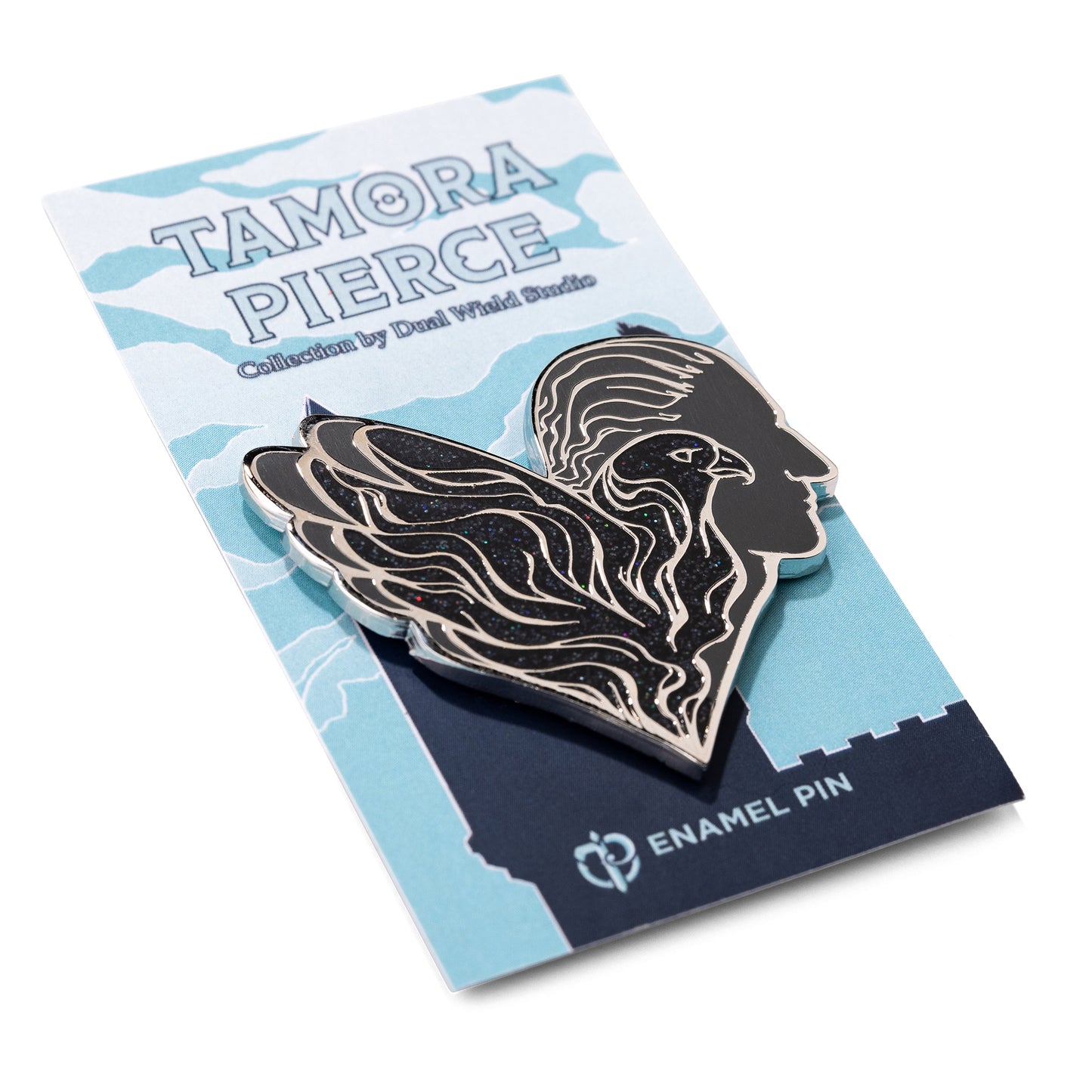 Angle view of the black sparkling Numair Pin on blue backing card.