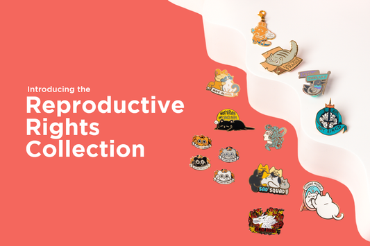 A photo of a selection of enamel pins and a zipper pull, with "Introducing the Reproductive Rights Collection" to the left.