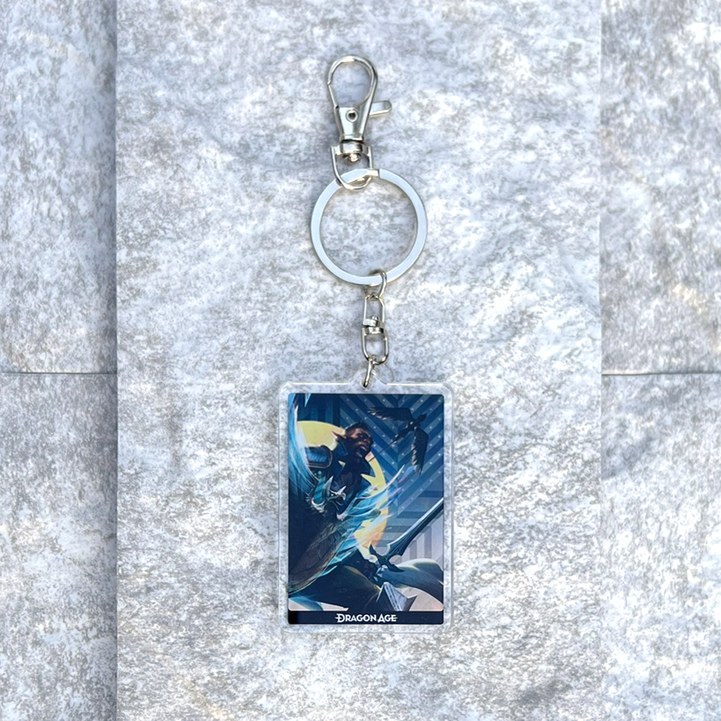 A photo from above of the Davrin acrylic keychain on white granite.