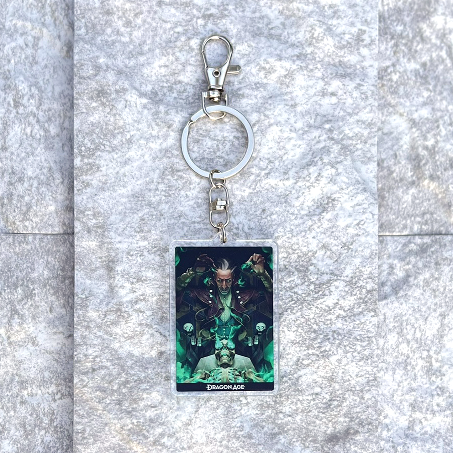 A photo from above of the Emmrich acrylic keychain on white granite.