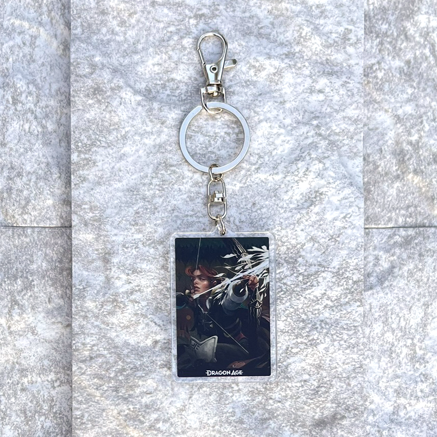 A photo from above of the Harding acrylic keychain on white granite.