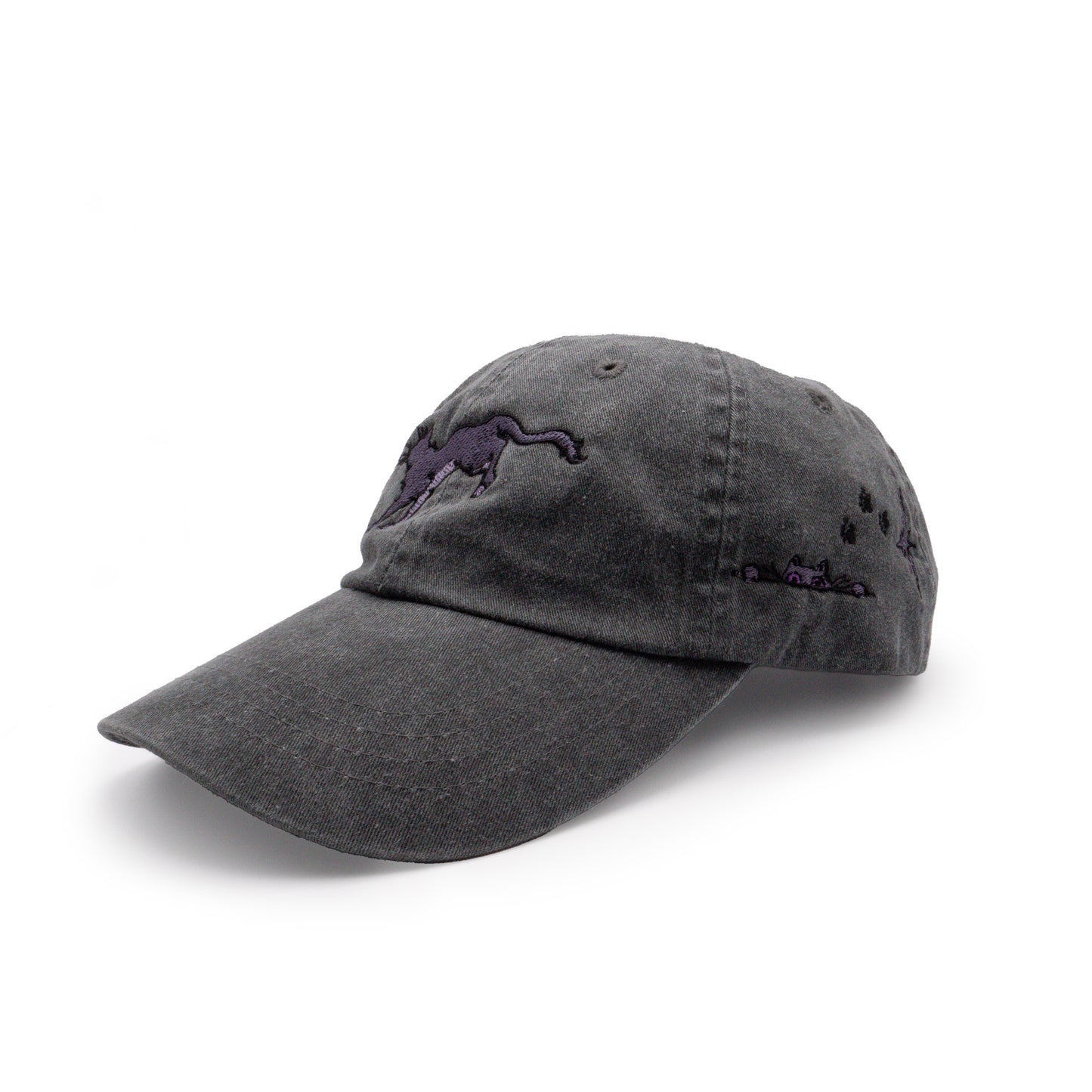 A three quarter view of the opposide side of the black Faithful embroidered hat. On the left side, an additional Faithful peeks up from an embroidered line. Black embroidered paw prints walk toward her followed by an embroidered purple shining star.