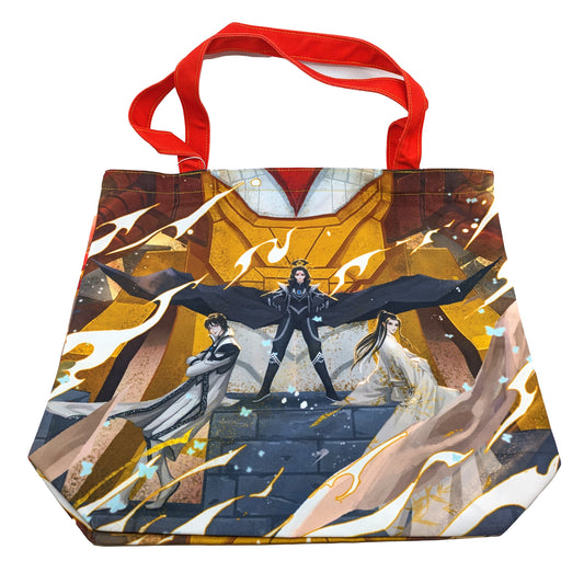  A product photo of the Iron Triangle Tote Bag. The illustration printed on it shows Zetian standing with her fists on her hips, a black cloak billowing from either side of her, reminiscent of wings. Shimin and Yizhi lean against the pedestal Zetian is standing on. The tote has a red shoulder strap.