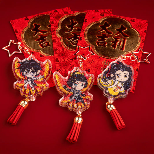 The Zetian, Yizhi, and Shimin holographic charms are paired with red Chinese new year envelopes.