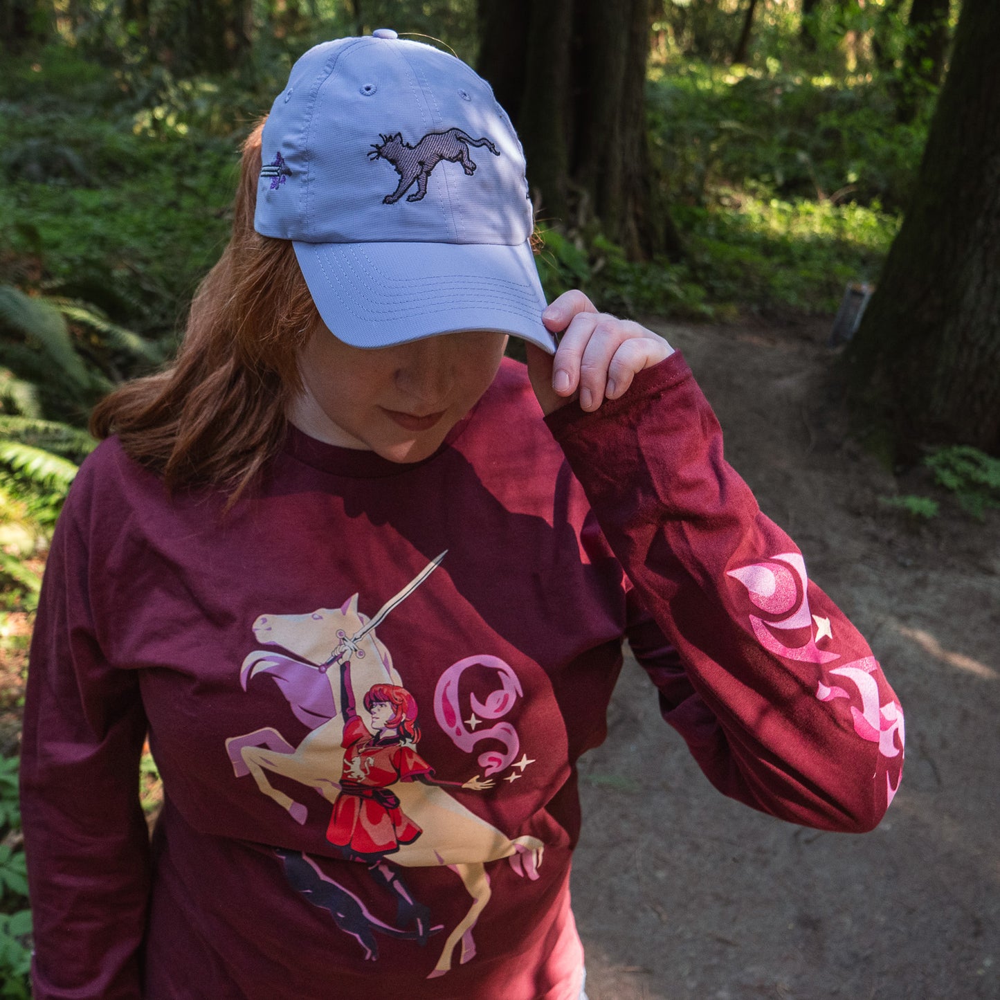 A model tipping the cap on the lavender Faithful Embroidered Hat.