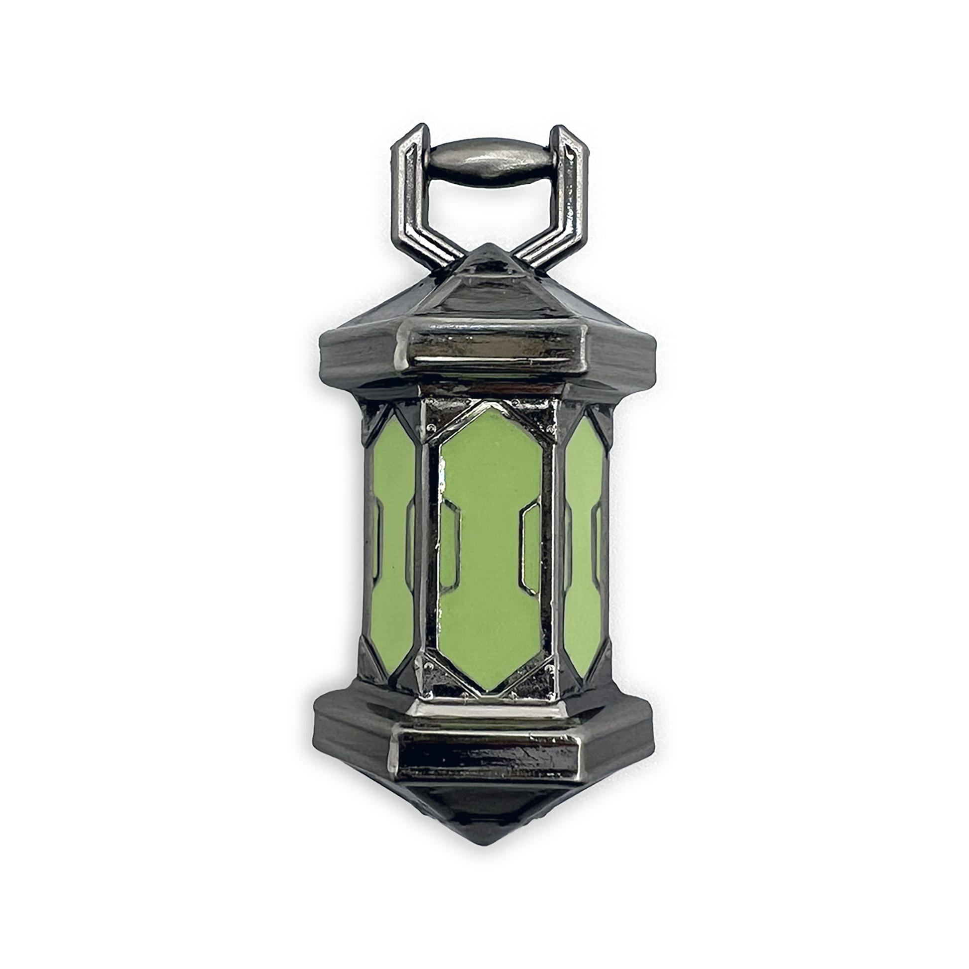 A product photo of the Gloaming Lantern Pin. The pin is cast in silver metal, and the three panes of the lantern are a bright foresty green. 