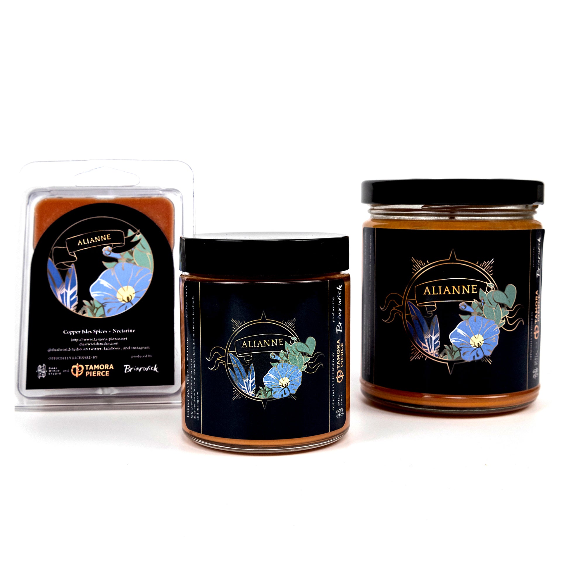 Full set of both Alianne candles and wax melts, all with orange wax. The labels show illustrations of blue feathers, blue morning glory and leaves within a golden circle with "Alianne" written on a ribbon across the top.
