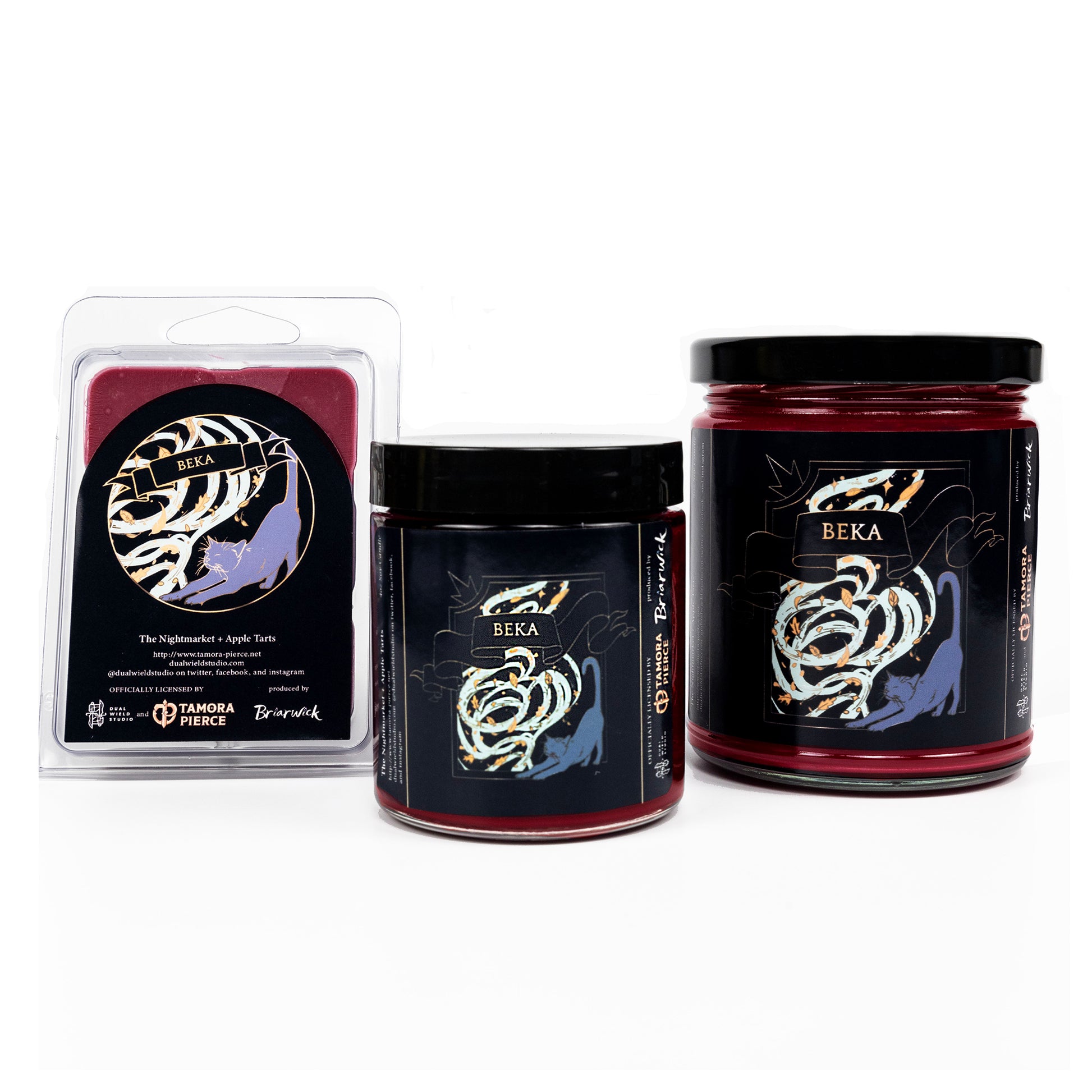 Full set of both Beka candles and wax melts, all with burgundy red wax. The label illustrations show a stretching cat in front of a gust of leaves. "Beka" reads on a ribbon across the top.