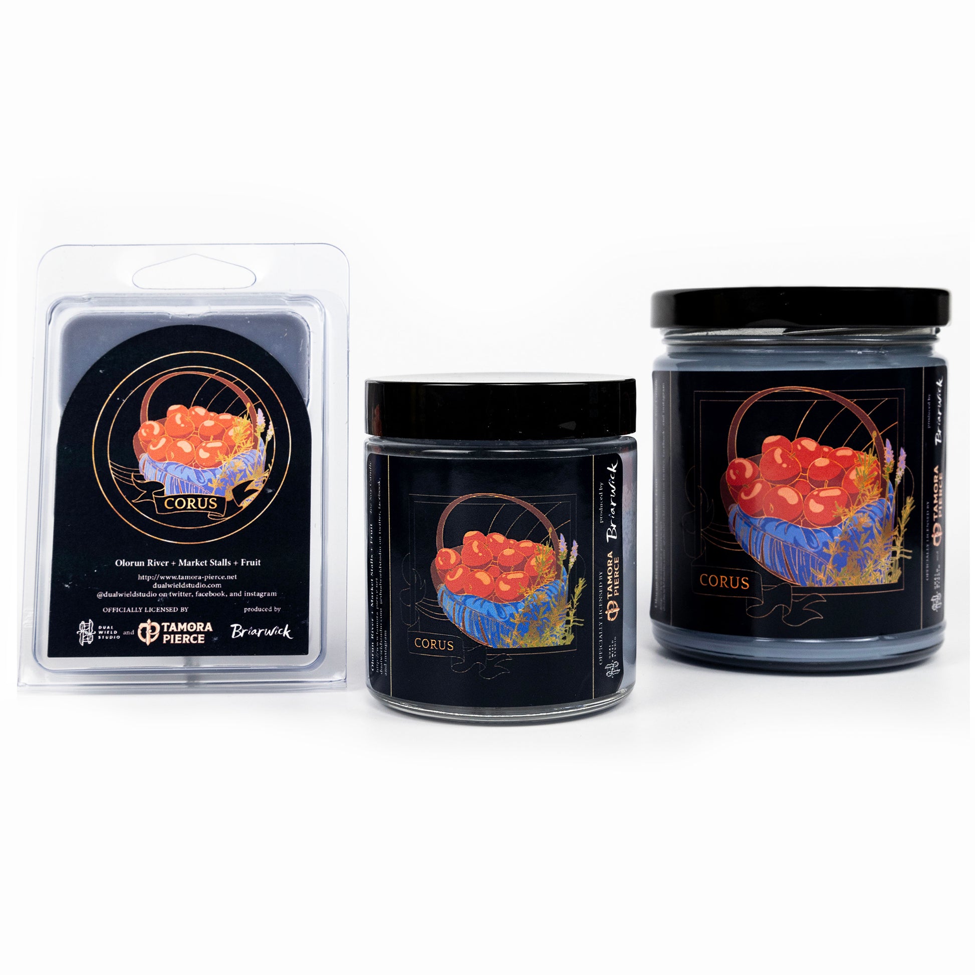 Full set of both Corus candles and wax melts, all with steel grey wax. The label illustration shows a basket of red cherries on a blue cloth.