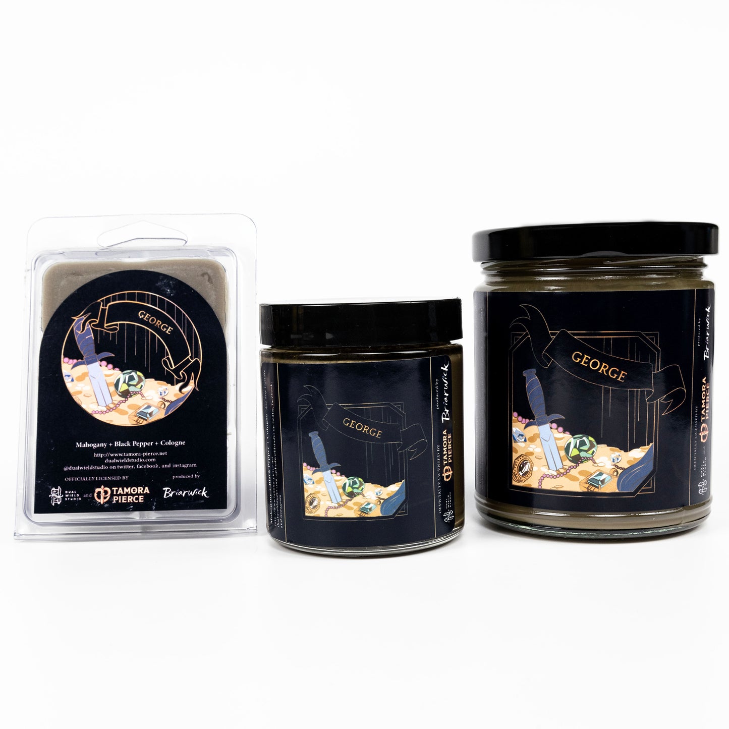 Full set of both George candles and wax melts, all with olive wax. The label illustrations show a dagger embedded in a pile of treasure. "George" is written across an angled ribbon.