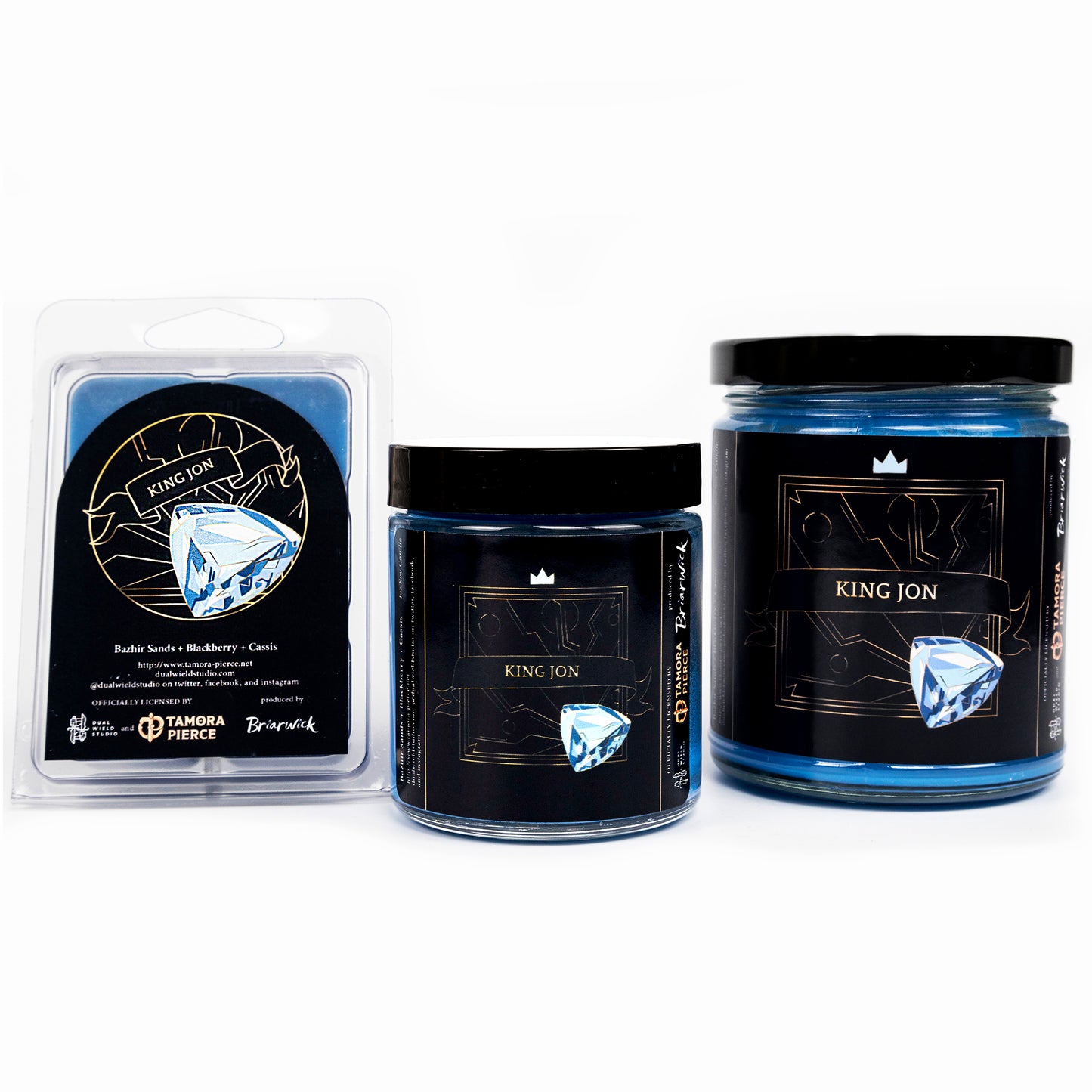 Full set of both King Jon candles and wax melts, all with blue wax. The label illustration depicts a shining blue jem. "King Jon" is written across a centered ribbon.