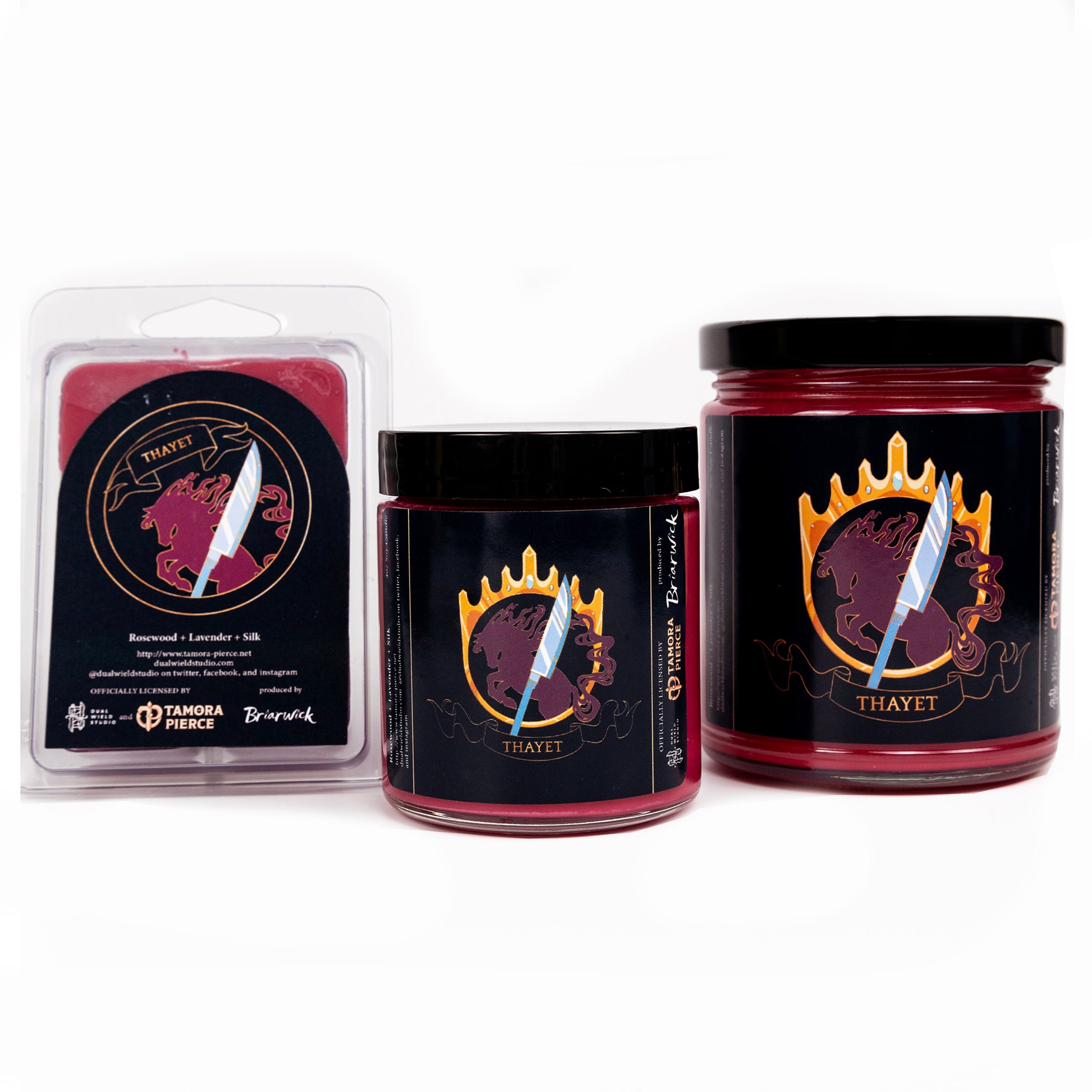 Full set of both Thayet candles and wax melts, all with red wax. The label illustration shows the silhouette of a leaping horse within a golden crown that also forms a ring. A silver glaive shines in the foreground with "Thayet" written on a ribbon below.