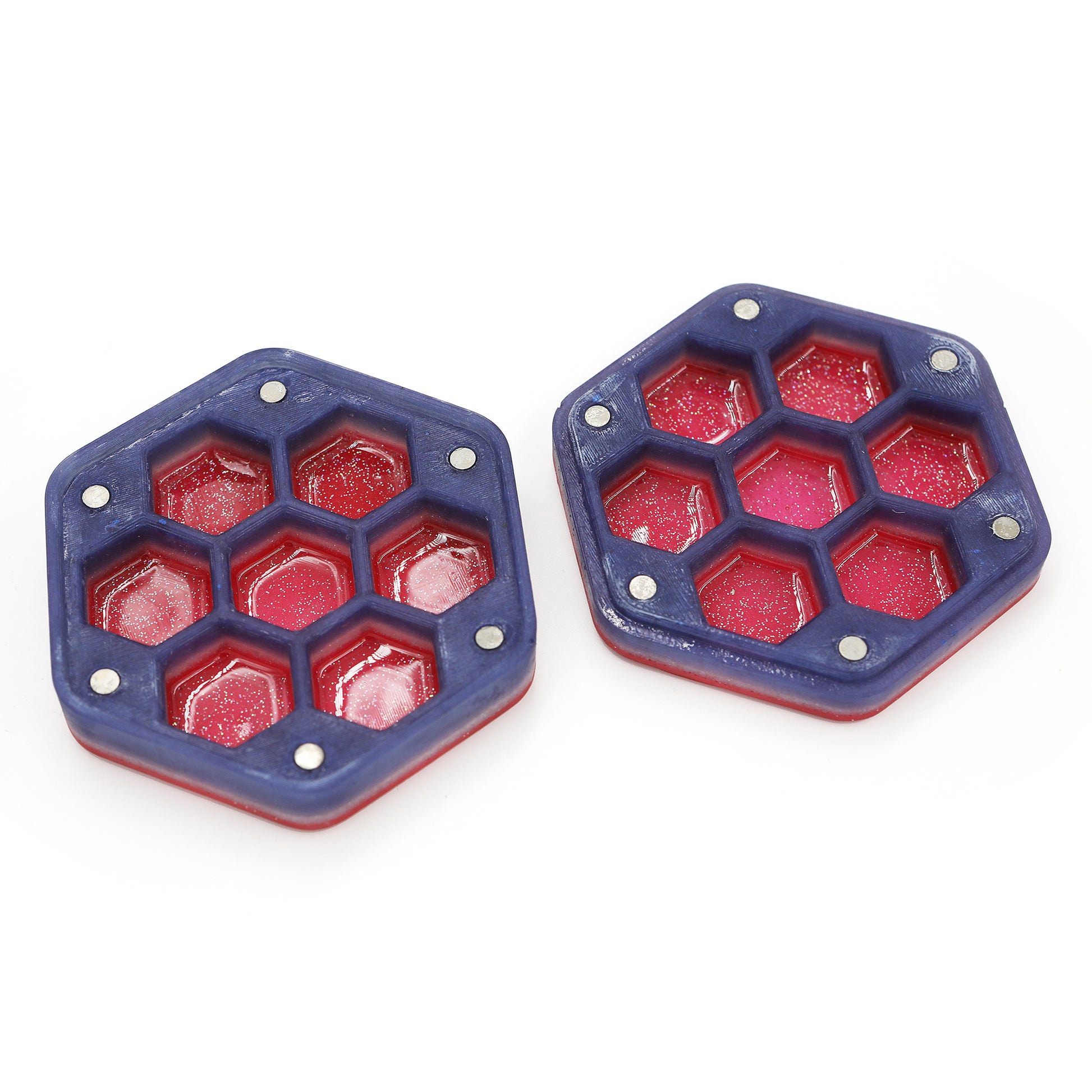 Inside view of hexagonal acrylic dice box. The purple honeycomb shape reveals glittery red pockets to hold dice.