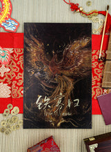 Load image into Gallery viewer, Phoenix Over Dragon Print on a bamboo mat with red elaborate runner surrounded by decorations. 