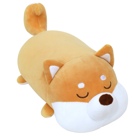 Angle view of Shiba cushion, a caramel and white plush with its eyes closed.
