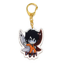 Load image into Gallery viewer, Shimin charm side two, illustrated with simpler orange jumpsuit and black and white bird wings.