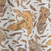 Load image into Gallery viewer, Closeup of Tamora Pierce: Griffins Scarf showing light marigold griffin stetching among feathers and other posing griffins.