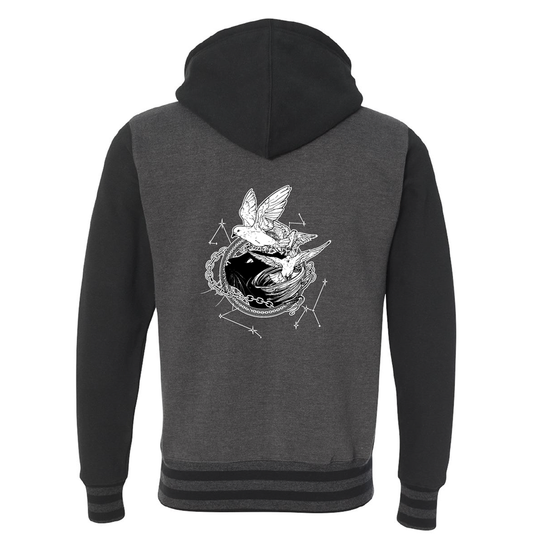 Back of Black and charcoal varsity hoodie with white illustration of Dustspinners, constellations, and chains swirling around Faithful the cat