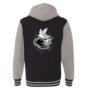 Back of Black and gunmetal varsity hoodie with white illustration of Dustspinners, constellations, and chains swirling around Faithful the cat