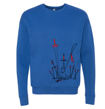 Load image into Gallery viewer, Blue sweatshirt, showing red and black outlined weapons embedded in the ground around a sitting Jump the dog.