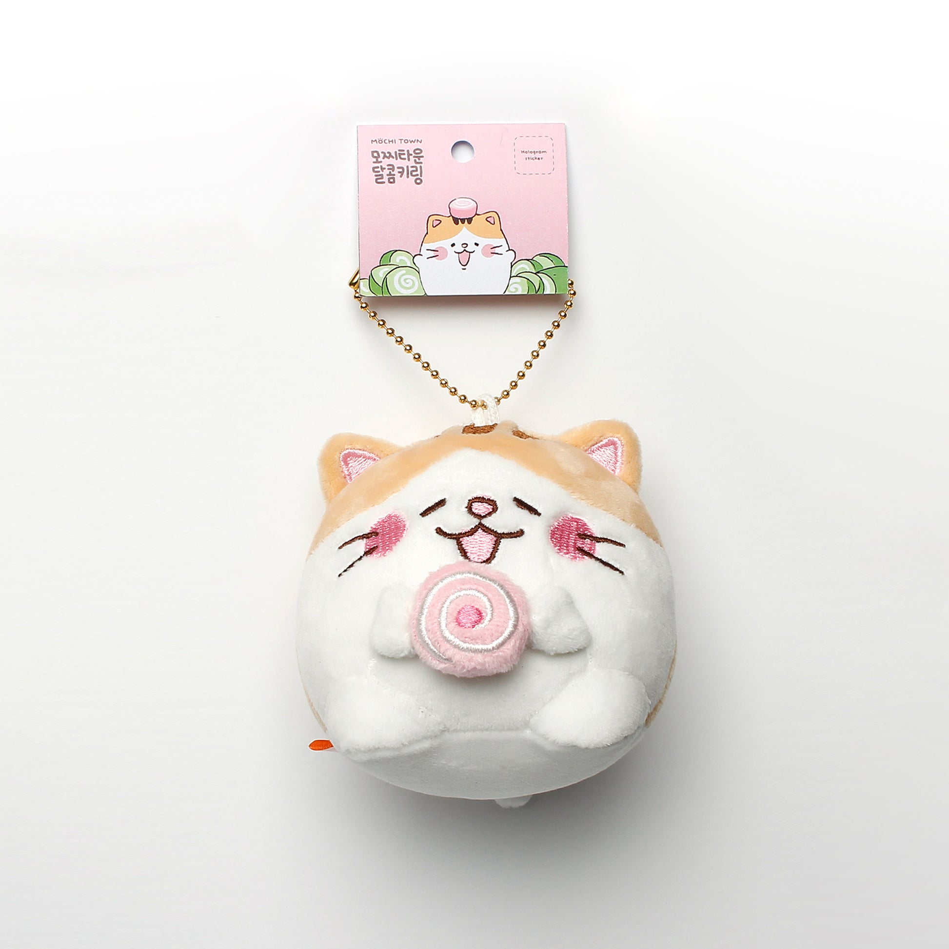 Bert (tan and white cat with pink cake roll) keyring hanging from tag on white background.