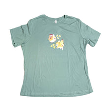 Load image into Gallery viewer, Teal bunnerfly tee laid flat on white background.