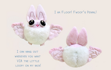 Load image into Gallery viewer, Front and back view of pastel pink Floof the Bat Plush with text that reads: &quot;I am Floof! Fwoof&#39;s penpal! I can hang out wherever you want via the little loopy on my back!&quot;