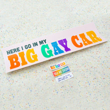 Load image into Gallery viewer, All three mini stickers together with a bumper sticker for scale. The mini stickers are extremely tiny compared to the regular sized &quot;Here I go in my Big Gay Car&quot; bumper sticker.