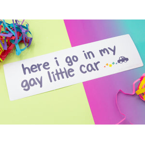 The bumper sticker rests with fun multicolored shredded paper balls.
