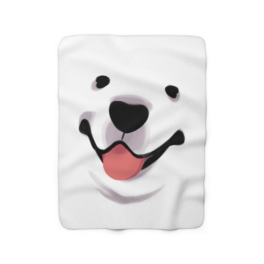 White blanket with closeup of Cloud the dog's face with pink tongue out, on white background