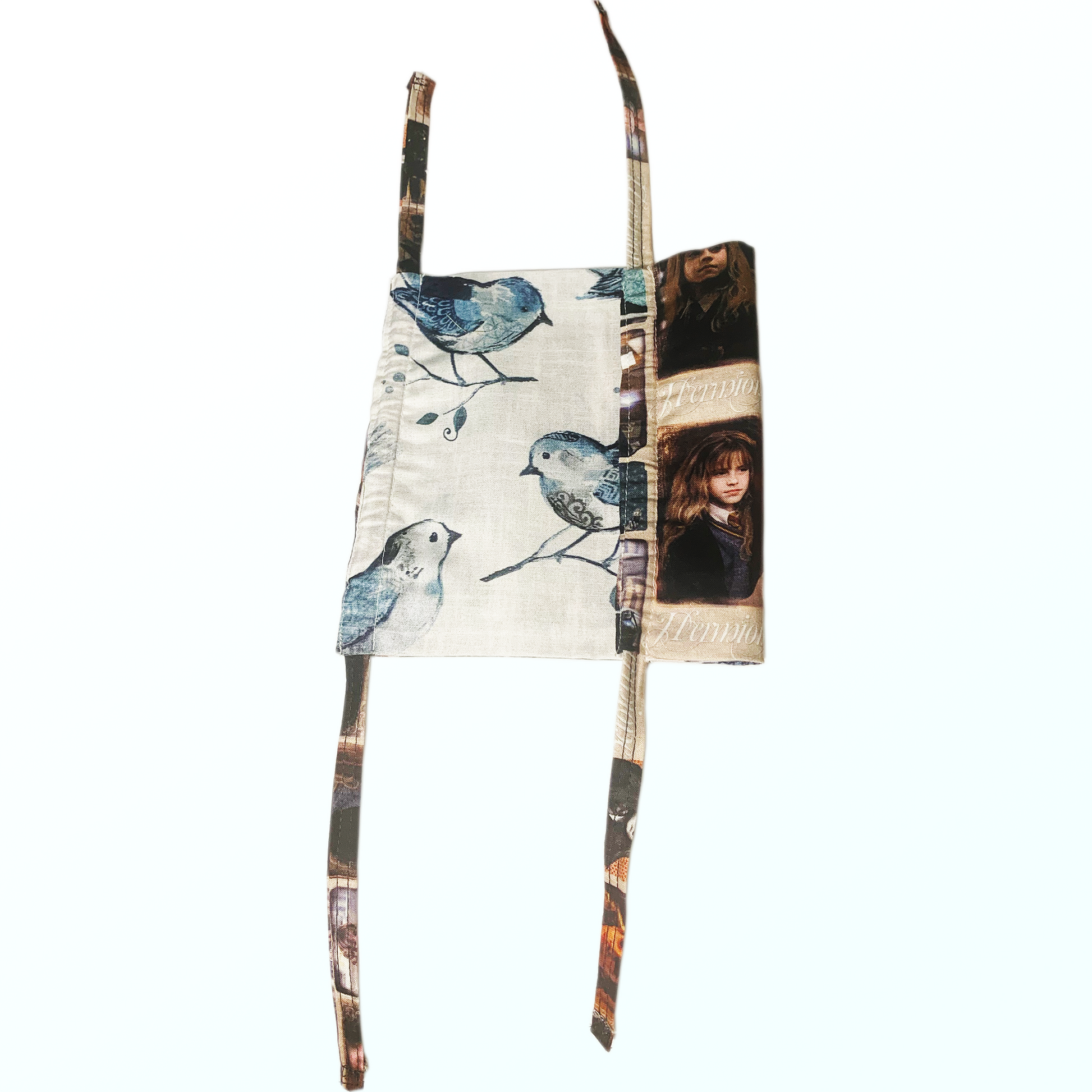 Bird pattern on opposite side of Hermione pattern mask on white background.
