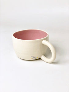 Back of white Virgo mug with blush pink inside.