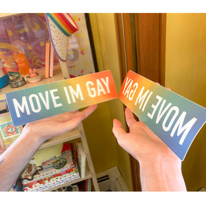 The bumper sticker is shown in front of a bedroom mirror to display how it is meant to be read.