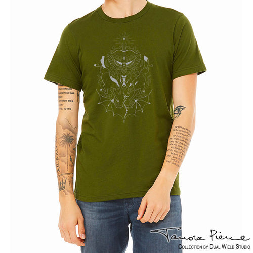 Olive green Daine Heraldry T-Shirt shown on model with white background. Symmetrical design depicts Skysong the dragon, Cloud the pony opposite a wolf, the head of the Badger god in the center b lelow a hawk and a bow and arrow pointed skyward.