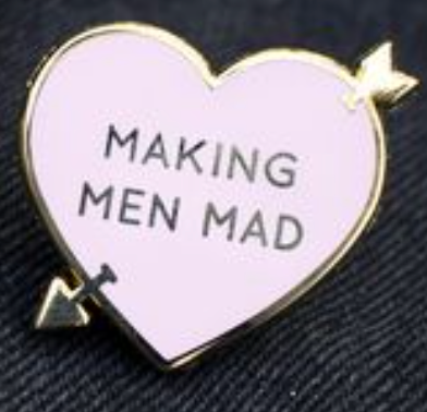 Gold and light pink enamel pin of heart with arrow piercing it, reading "Making Men Mad."