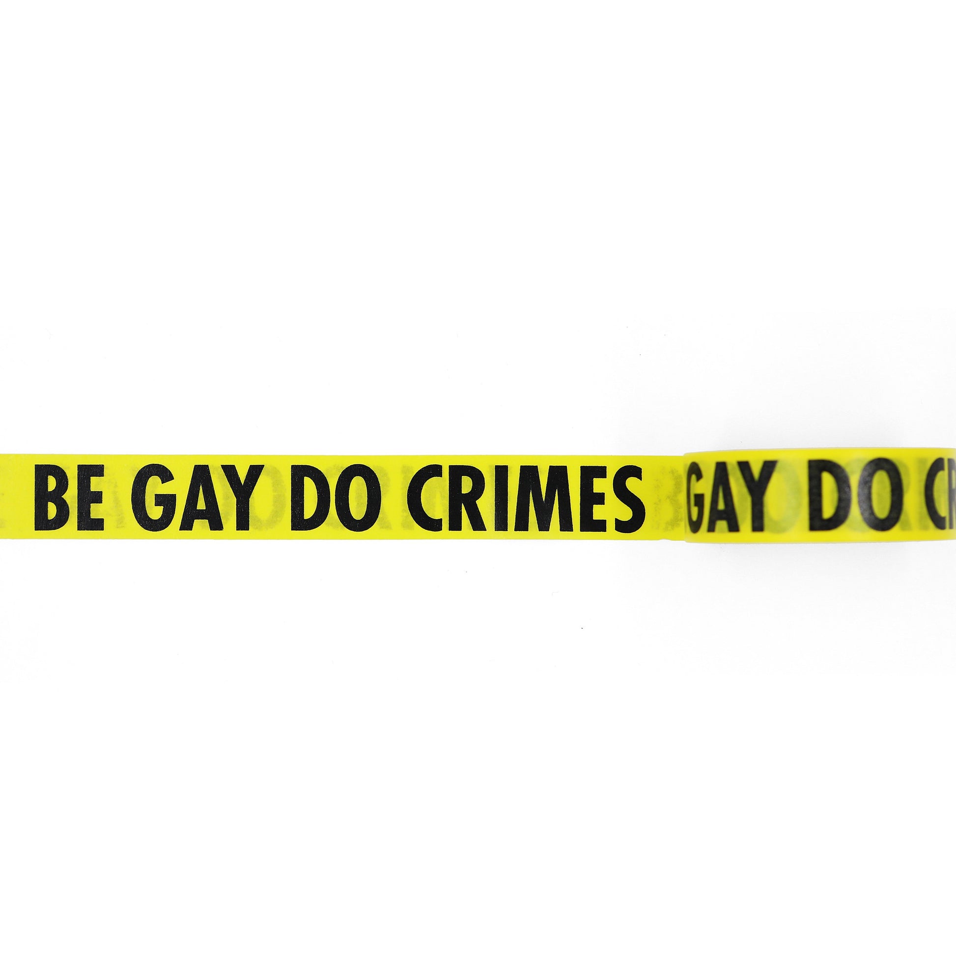 Yellow, caution-tape inspired washi tape with black "BE GAY DO CRIMES" text on white background