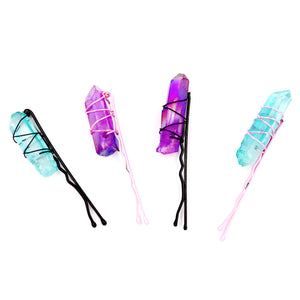 All four crystal hair clips on white background.