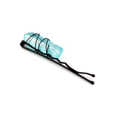 Load image into Gallery viewer, Light blue crystal on black pin on white background.