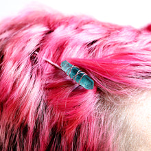 Load image into Gallery viewer, Light blue crystal on pink pin on model with pink hair.